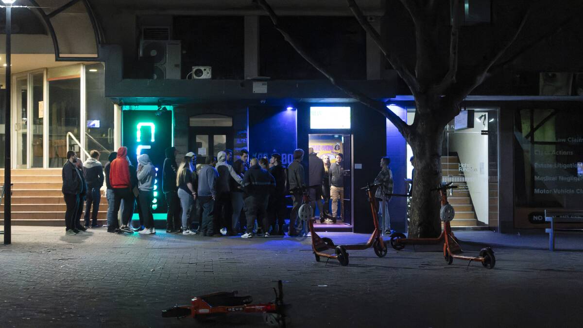 Clubgoers stand outside Cube nightclub. Picture: Keegan Carroll