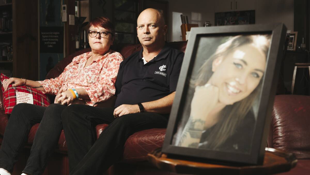 Janine Haskins with husband Peter McLaren and a picture of her daughter, Bronte, at their home in Cook. Picture by Dion Georgopoulos