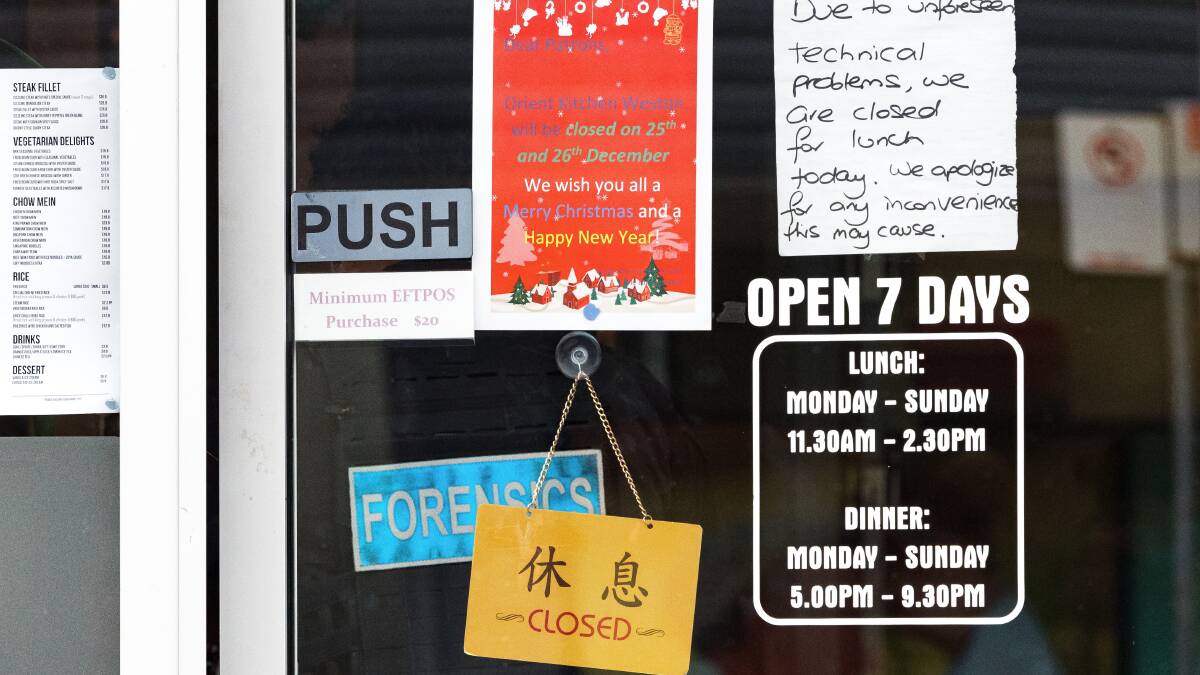 The sign on Orient Kitchen's door on Monday. Picture by Sitthixay Ditthavong