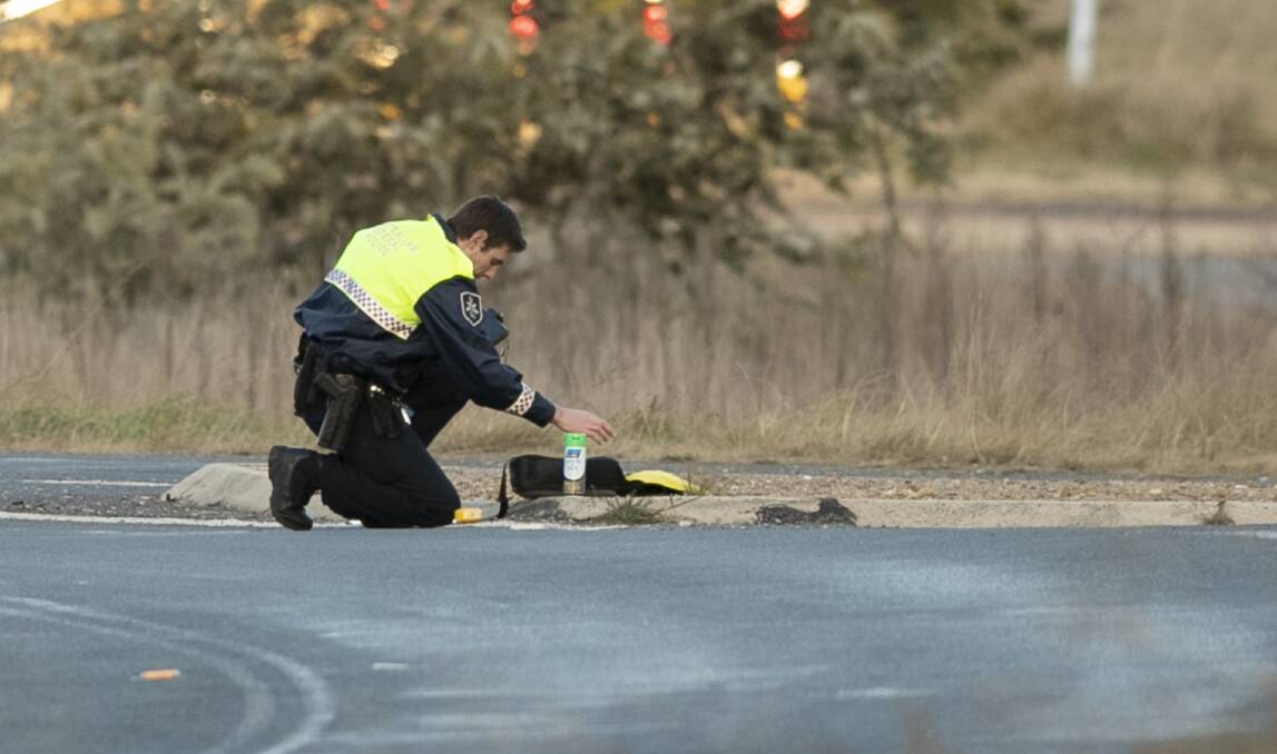 A police officer investigates the scene of the incident. Picture: Keegan Carroll