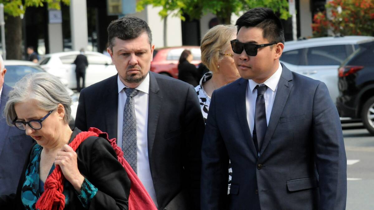 Parker Bellette, right, outside court with barrister Margaret Jones SC and solicitor Michael Kukulies-Smith. Picture by Blake Foden