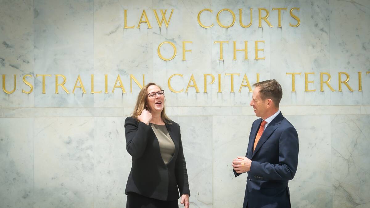 Justice Lucy McCallum speaks to ACT Attorney-General Shane Rattenbury outside the Supreme Court on Tuesday. Picture: Karleen Minney