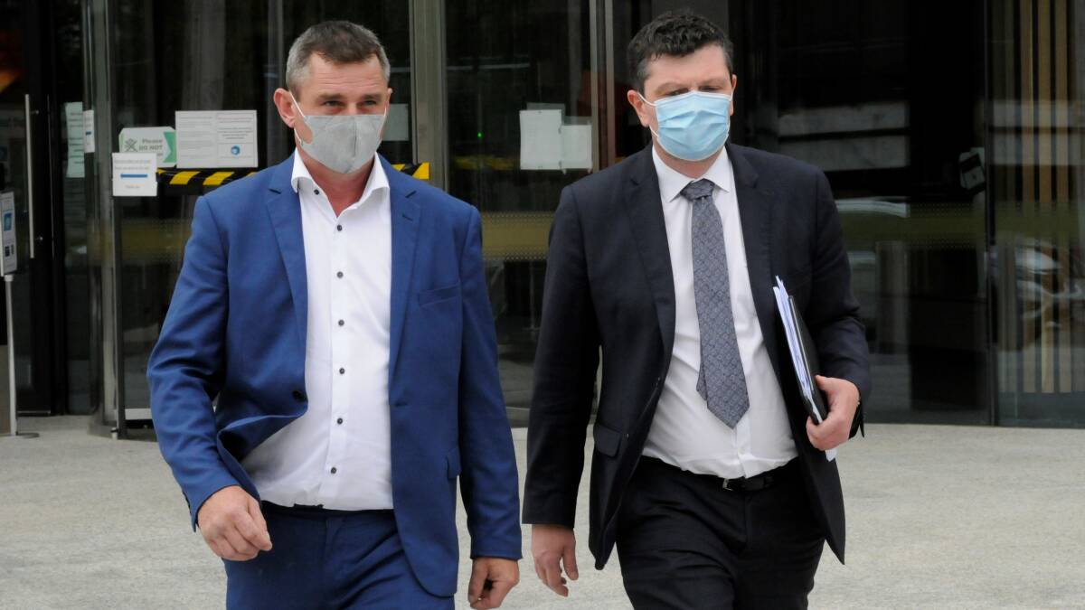 Richard Lanigan, left, leaves court with lawyer Michael Kukulies-Smith. Picture: Blake Foden