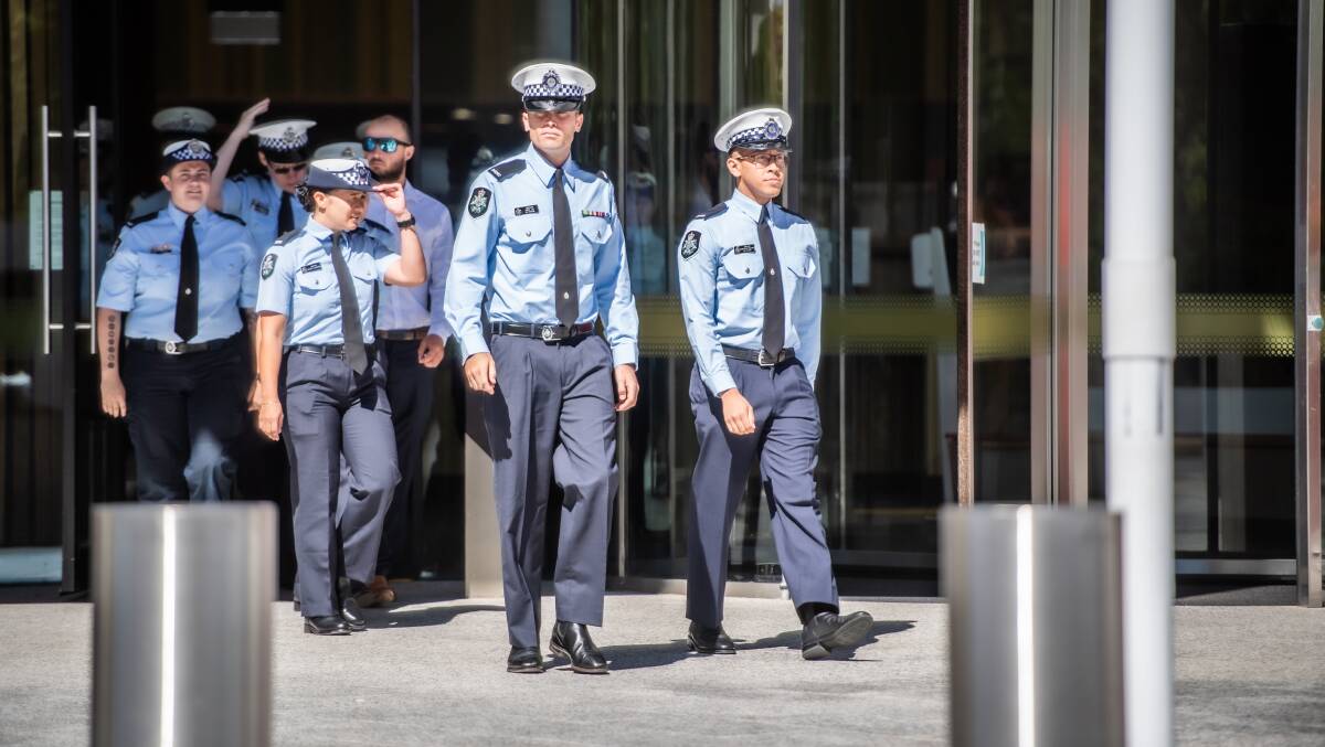 Some of the dozens of police officers who attended Thomas Matthews' sentence hearing leave court. Picture by Karleen Minney