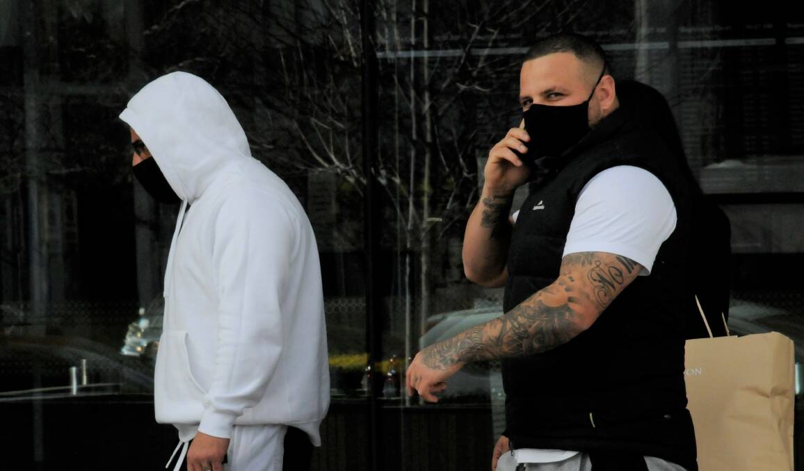 Jomal Nchouki, right, leaves court with brother Mohammed. Picture: Blake Foden