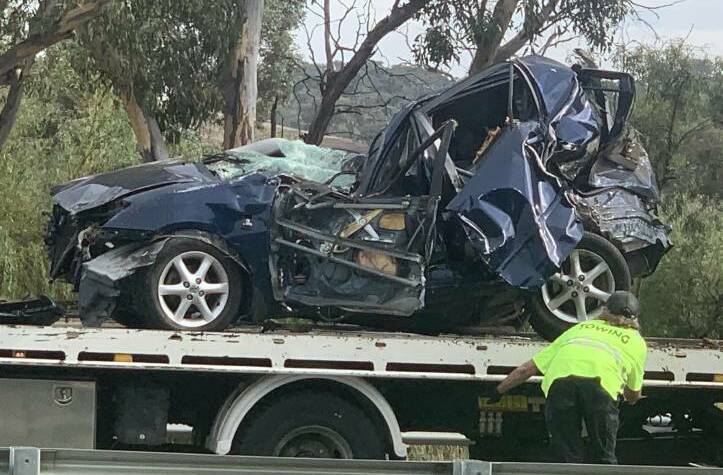 The victim's Toyota Corolla, which rolled and hit a tree. Picture: Julia Kanapathippillai