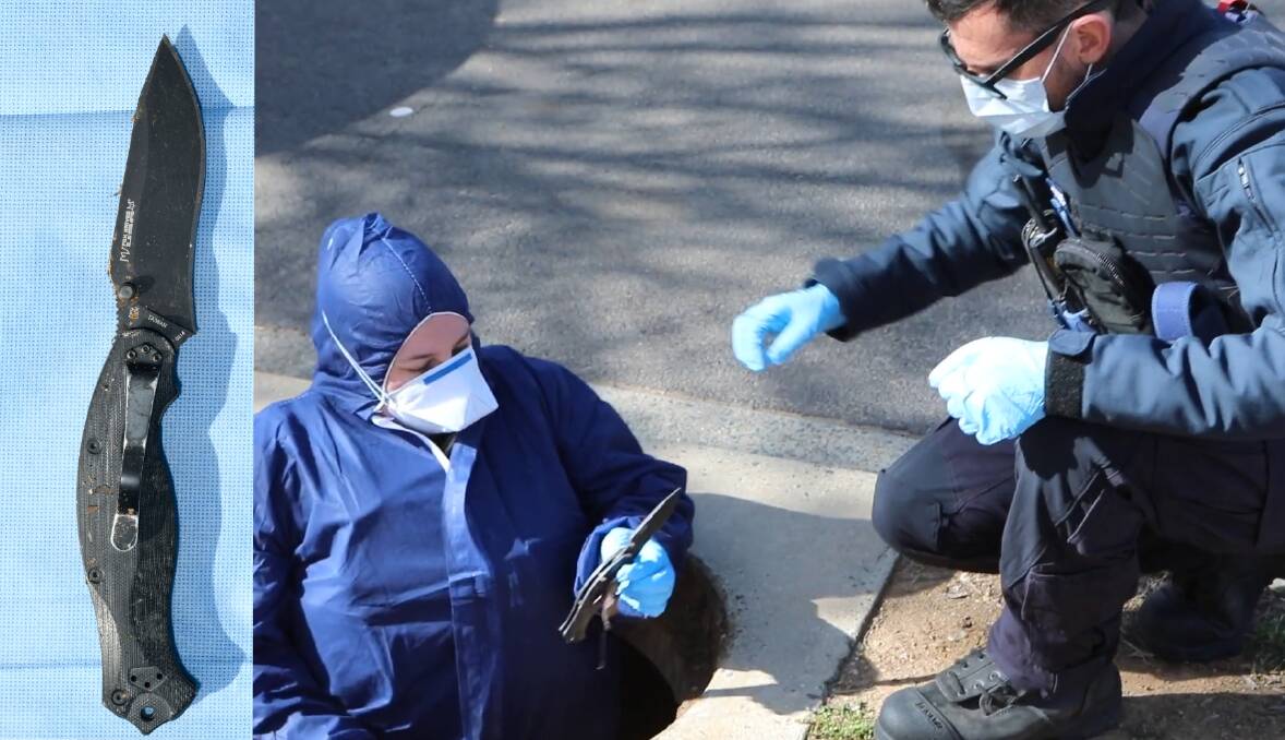 A knife described by police as the suspected murder weapon is removed from a drain in Turner earlier this month. Pictures: ACT Policing