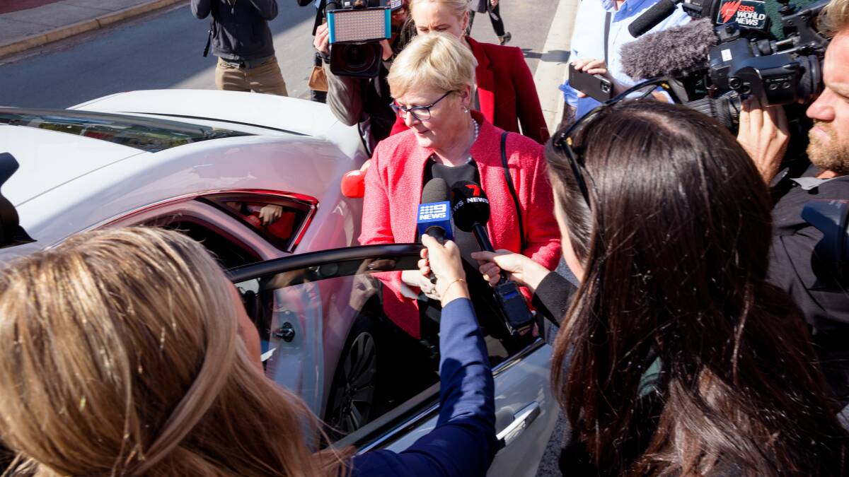 Reporters surround Linda Reynolds after she gave evidence in Bruce Lehrmann's trial. Picture by Sitthixay Ditthavong