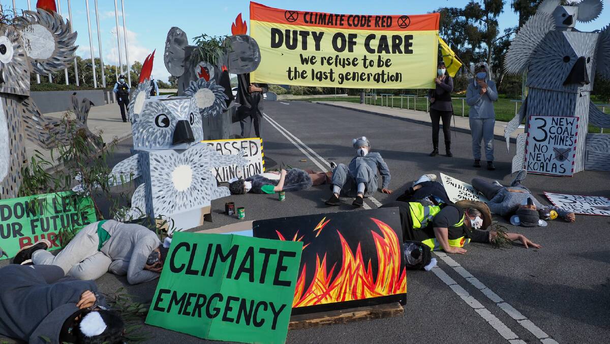 Climate protesters outside Parliament House on the day of Jeremy Rhind's arrest. Picture by Extinction Rebellion ACT