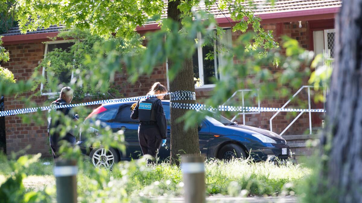 Police inspect the damaged Ford Focus at the scene of the incident. Picture: Elesa Kurtz