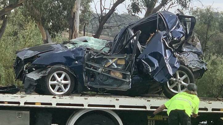 The victim's car is loaded onto a tow truck after the crash. Picture: Julia Kanapathippillai