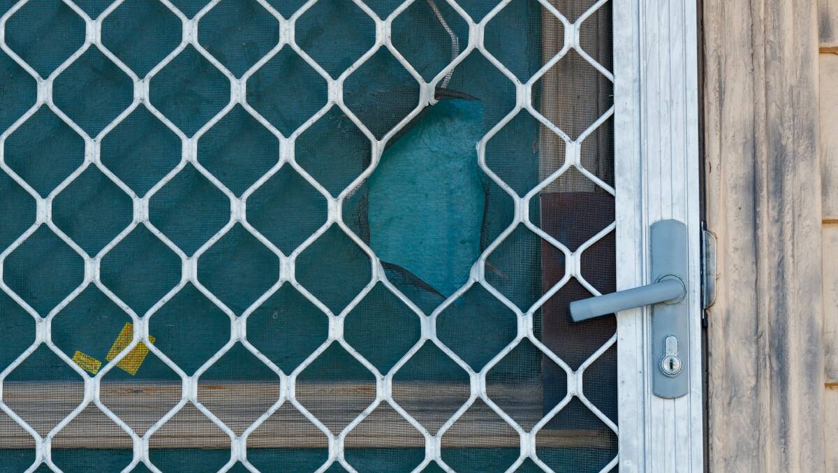 The hole left in Stacey Klimovitch's screen door by the shotgun blast that killed her. Picture: Max Mason-Hubers