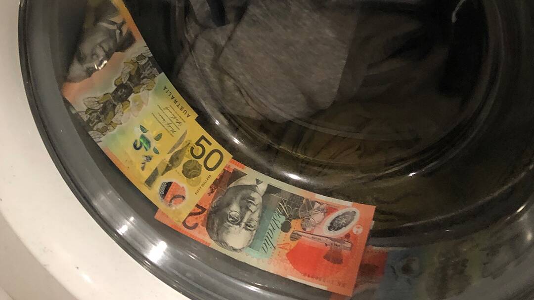 Cash found in the washing machine at John Wright's Braddon unit. Picture ACT Policing