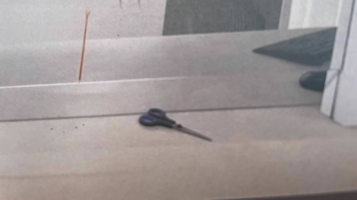 The scissors on the Queanbeyan Police Station counter after the alleged murder attempt. Picture supplied
