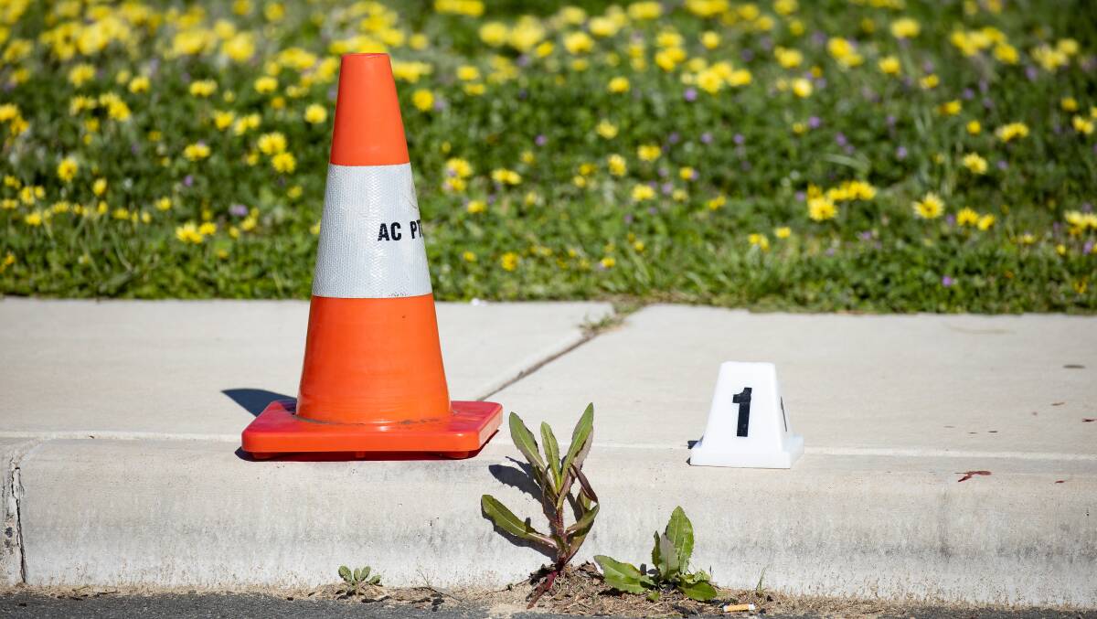 A police evidence marker at the scene in the aftermath of the fatal fight. Picture: Sitthixay Ditthavong