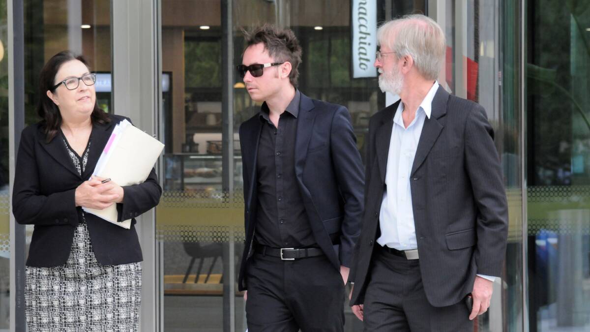 Steven Black, centre, outside court last year with barrister Frances Lalic, left, and his father. Picture: Blake Foden