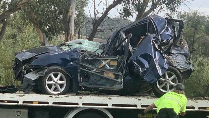 The victim's Toyota Corolla, which rolled and hit a tree. Picture: Julia Kanapathippillai