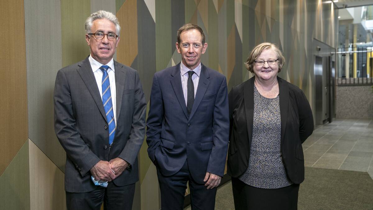 Newly appointed coroner Ken Archer, left, and magistrate Jane Campbell, right, with ACT Attorney-General Shane Rattenbury. Picture: Keegan Carroll