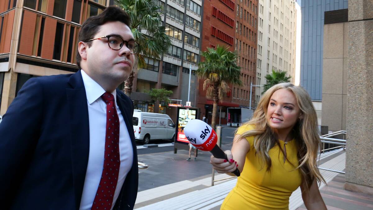 A journalist questions Bruce Lehrmann, left, outside court last week. Picture Getty Images