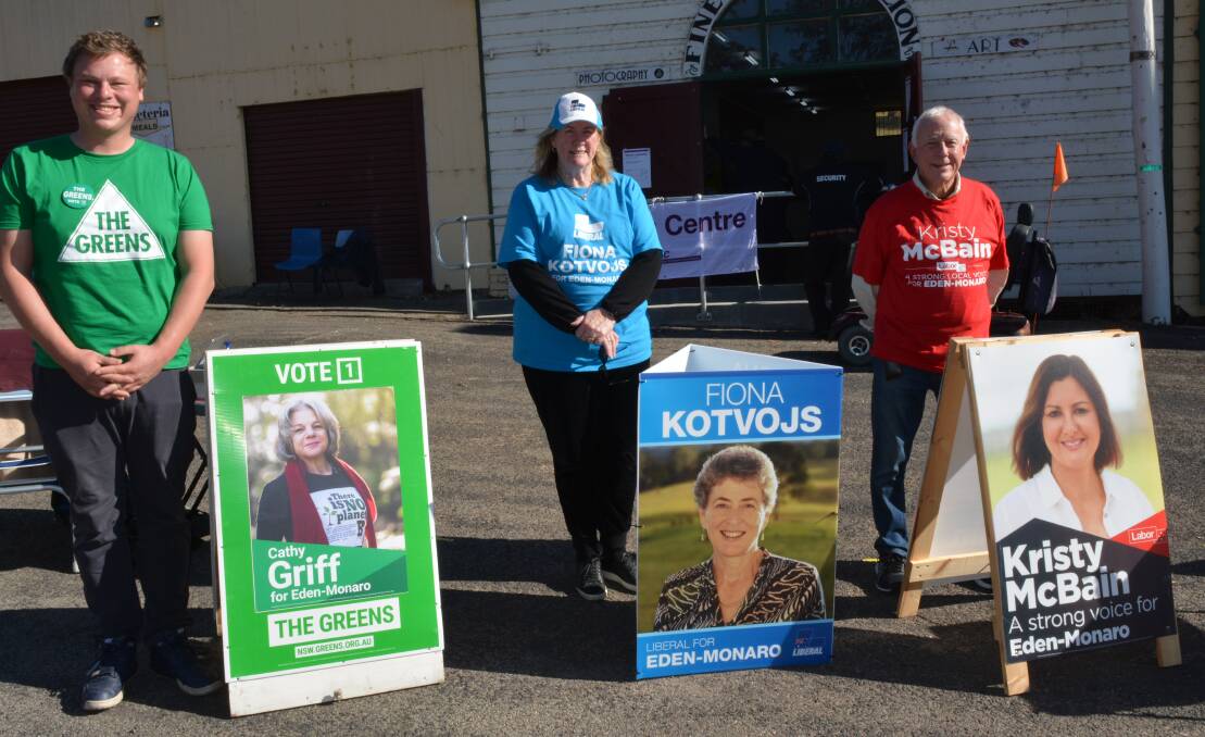 Jerry Langford, Carol Carmody and Rick Fletcher man the candidate info tables at Bega's pre-polling centre on Monday morning. Photo: Ben Smyth