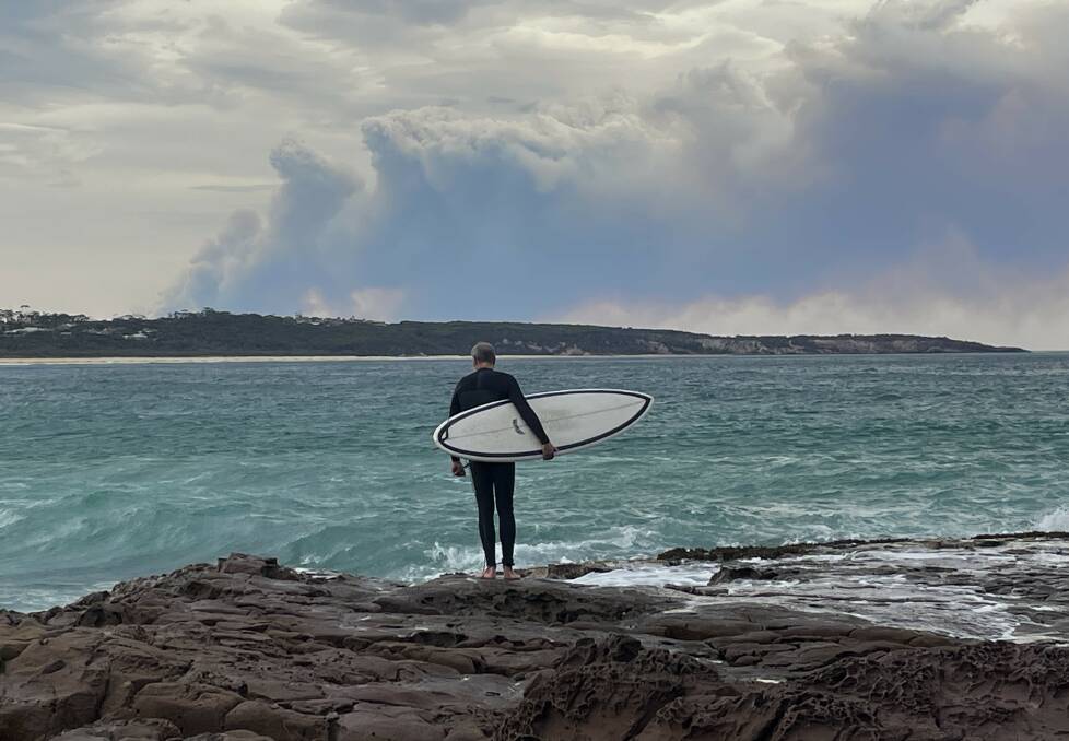 The smoke plume as seen from further south at Tura Beach. Picture by James Parker