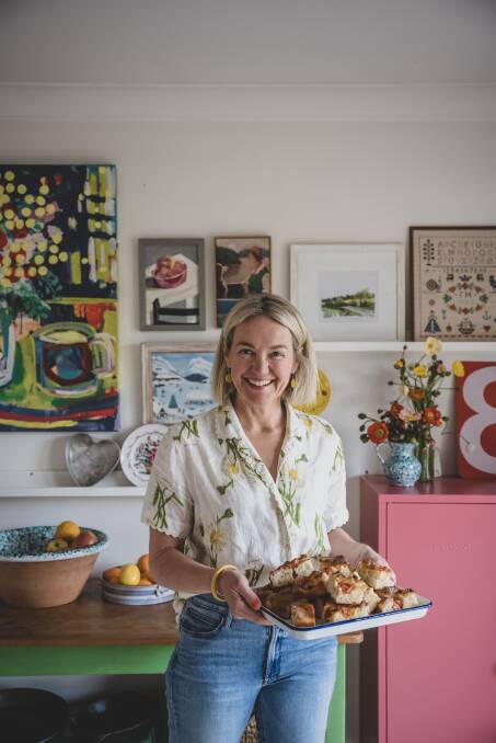 Sophie Hansen holding the front cover baking from her cookbook. Picture is by Pip Farquharson 