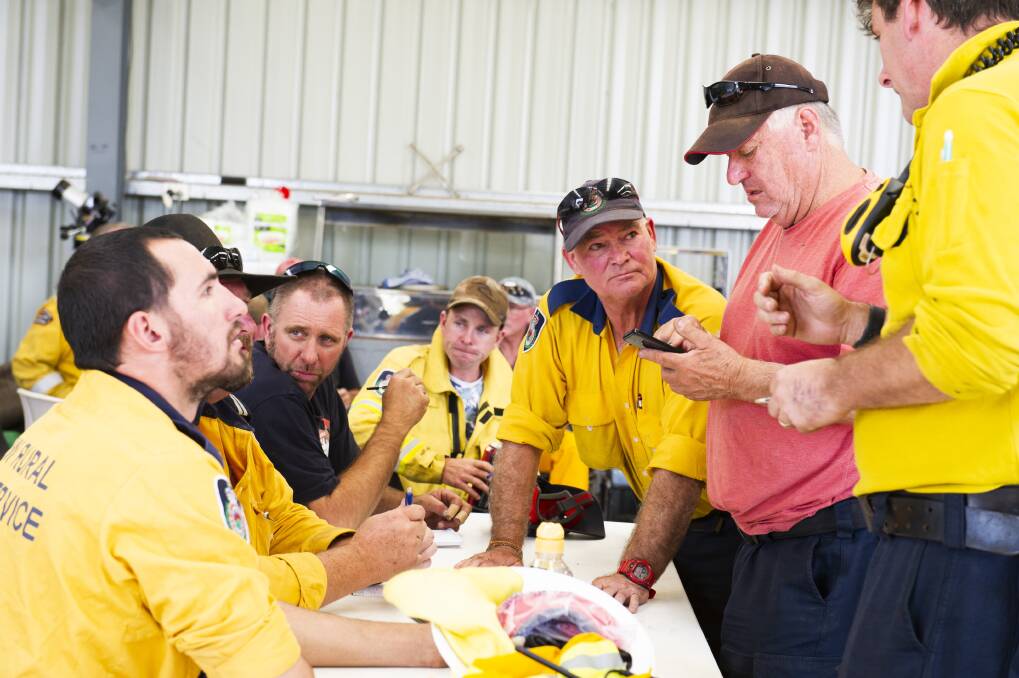 Fire crews prepare at the Adaminaby Rural Fire Service shed on Friday. Picture: Dion Georgopoulos
