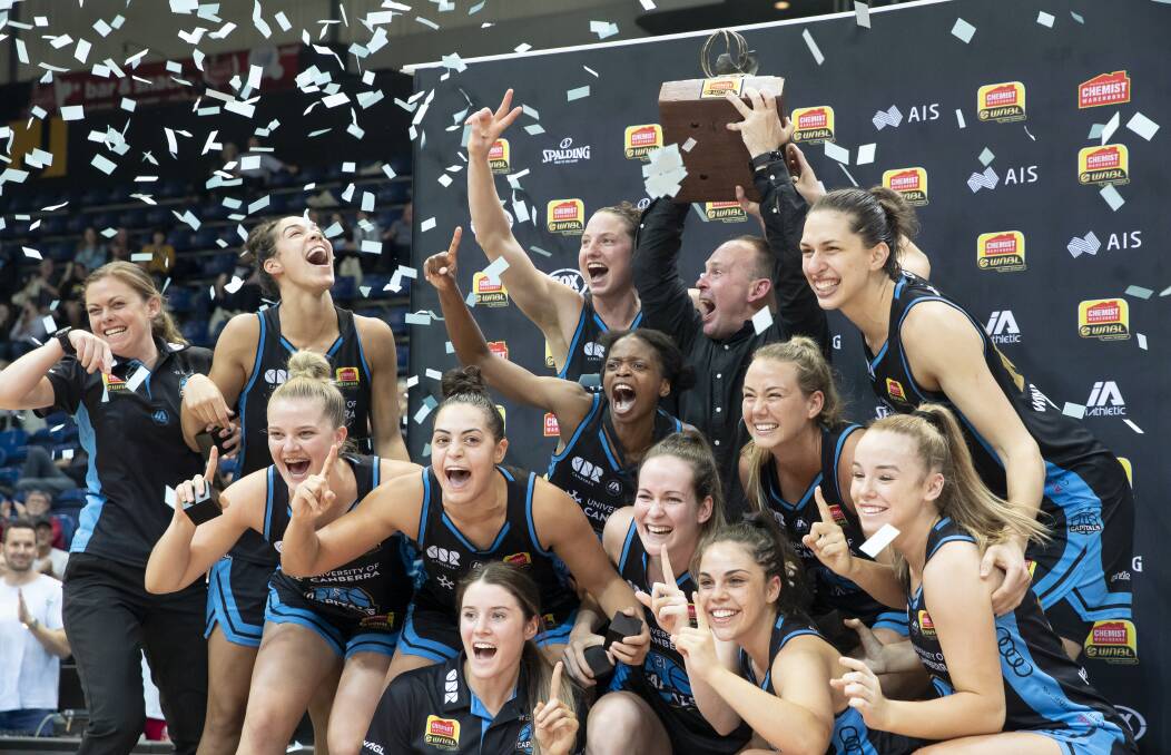 The Canberra Capitals celebrate their WNBL title. Picture: Sitthixay Ditthavong