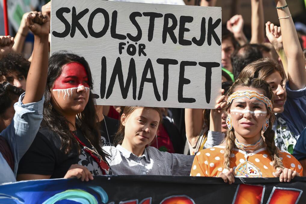 Greta Thunberg, centre, at a climate strike in Montreal, Canada. Picture: Getty Images