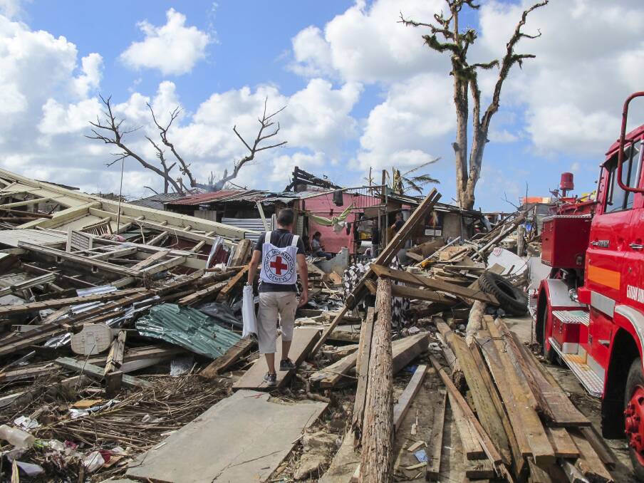 ICRC staff in the Eastern Samar province in the Philippines after a typhoon in 2013. Picture: Dennis Ramos/ICRC