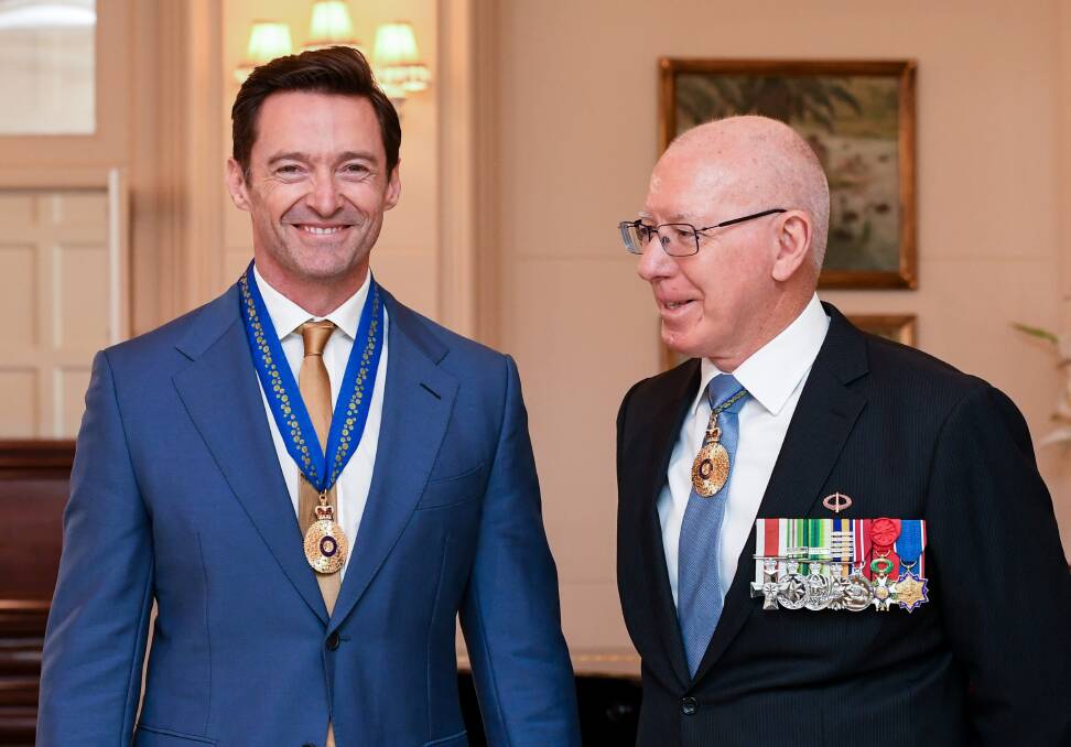 Hugh Jackman is awarded an Order of Australia by the Governor-General of Australia, David Hurley, at Government House. Picture: Getty Images