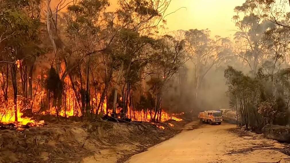The video shows firefighters battling the Orroral Valley bushfire last Monday. Picture: Martin Greenwood