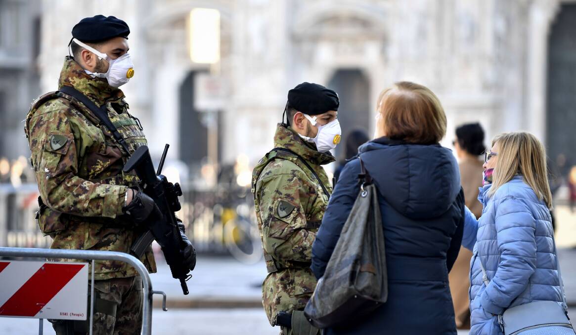 Military officers wearing face masks in Italy. Australia has advised people not to travel to the Lombardy area in northern Italy. Picture: Shutterstock