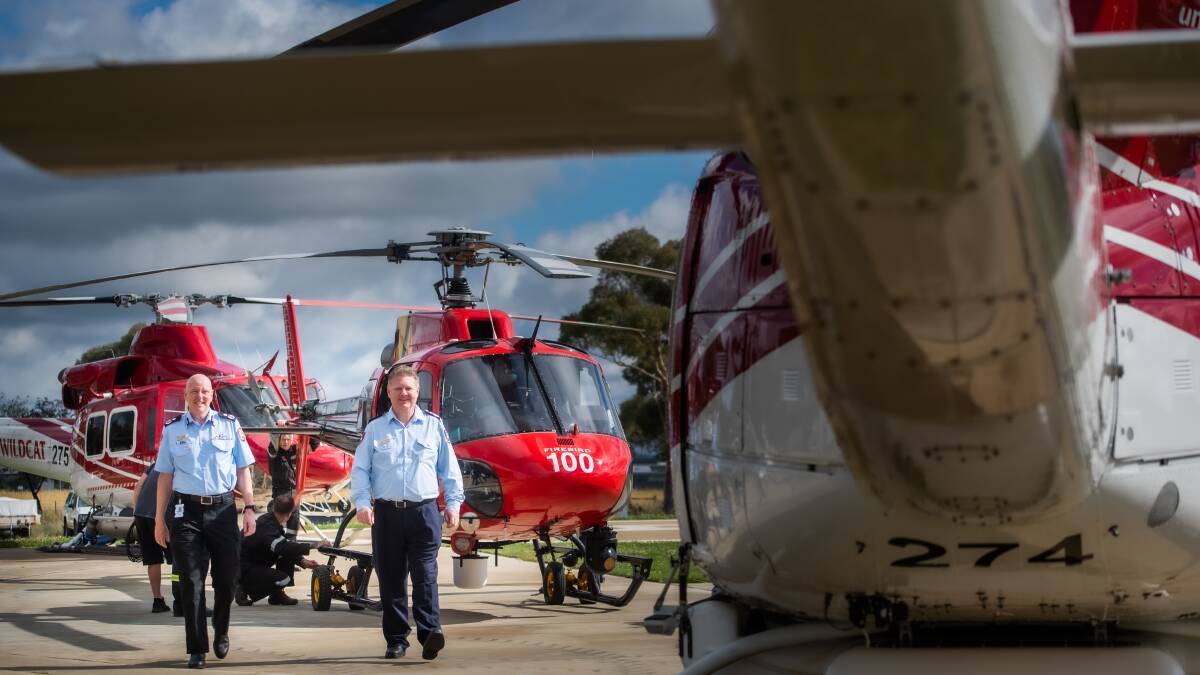ESA Deputy Commissioner, Ray Johnson and ACT RFS Chief officer Rohan Scott taking delivery for three firefighting helicopters to the ACT. Picture: Karleen Minney.