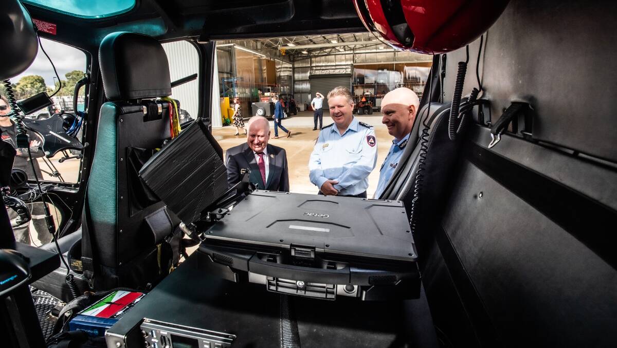 Minister Emergency Services Mick Gentleman, ESA deputy commissioner, Ray Johnson and ACT RFS chief officer Rohan Scott inspecting the helicopters. Picture: Karleen Minney 