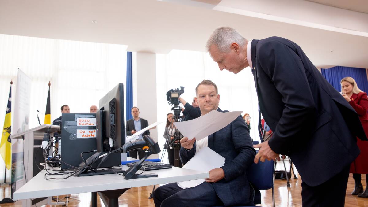 ACT Deputy Electoral Commissioner Ro Spence and Electoral Commissioner Damian Cantwell conduct the Yerrabi countback on Thursday. Picture: Sitthixay Ditthavong