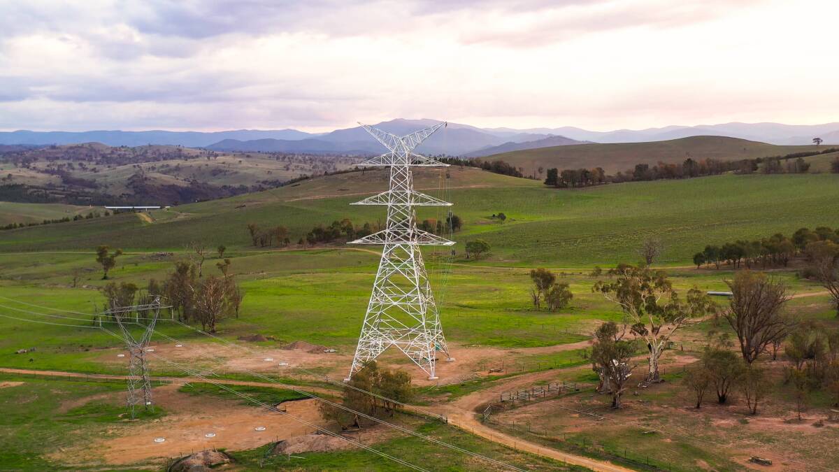 A newly constructed electric transmission tower on mountainous green fields at Strathnairn. Picture: Shutterstock