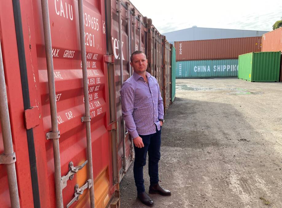 RAISING AWARENESS: Steve Byrnes, managing director of Newcastle firm Container Traders with some of the company's containers. Mr Byrnes has been spreading the word about online scams. Picture: Container Traders