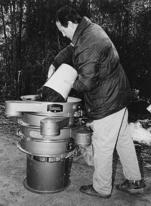 Detective Stephen Bromhead working on the 'body in the bush' investigation in Kiwarrak Forest near Taree in 1985.