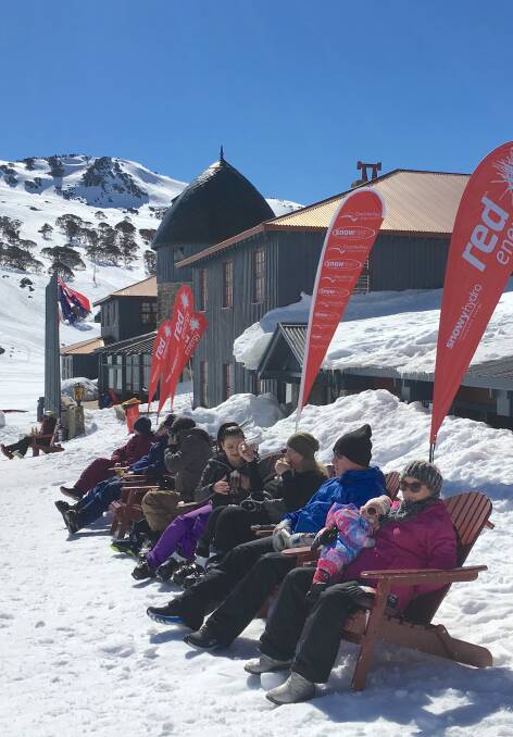 Enjoying the sun outside the iconic Kosciuszko Chalet Hotel at Charlotte Pass. Picture: Tim the Yowie Man