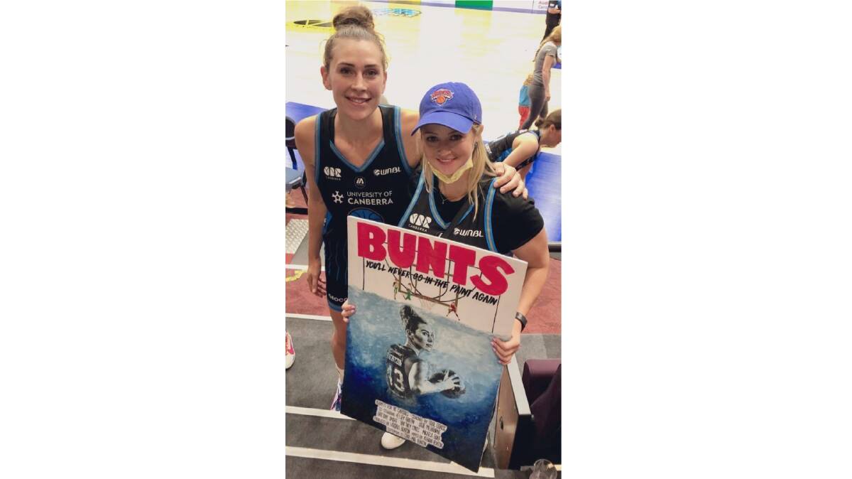Alex and Emma with the poster that became a T-shirt. Picture: Supplied