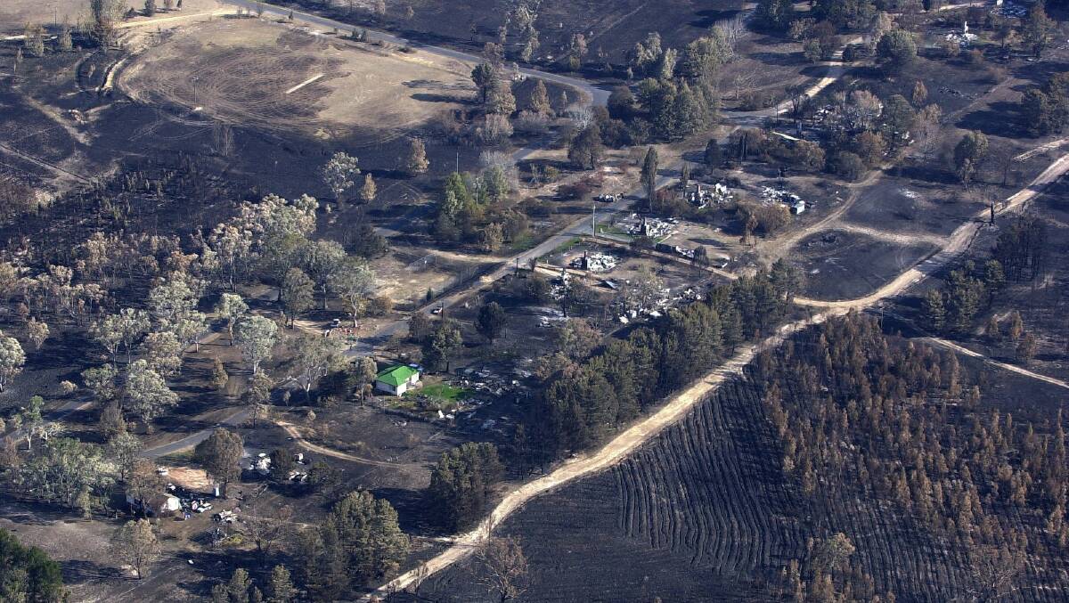 Uriarra Village after the Canberra bushfires in 2003. Picture: Graham Tidy