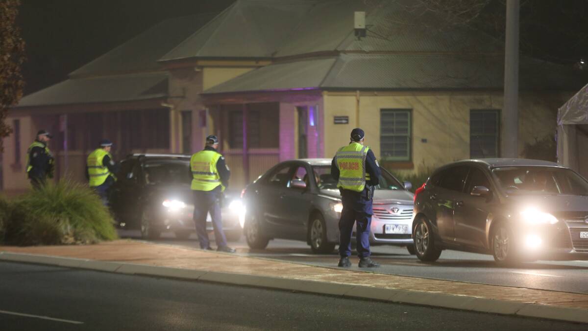 NSW police checking cars trying to come across the Victorian border last month. Picture: NSW Police