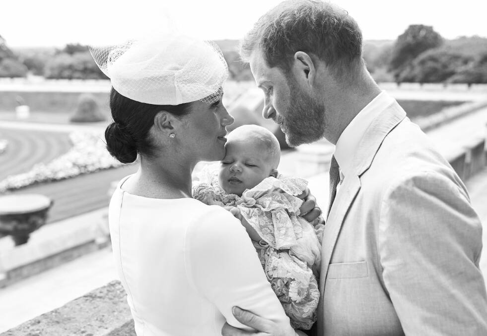 This official christening photograph released by the Duke and Duchess of Sussex shows the Duke and Duchess with their son, Archie Harrison Mountbatten-Windsor at Windsor Castle with with the Rose Garden in the background. Picture: Chris Allerton