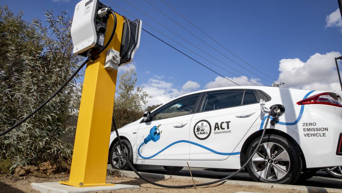 An ACT government vehicle charges at an electric vehicle charging station at the West Belconnen Child and Family Centre in Holt. Picture: Sitthixay Ditthavong