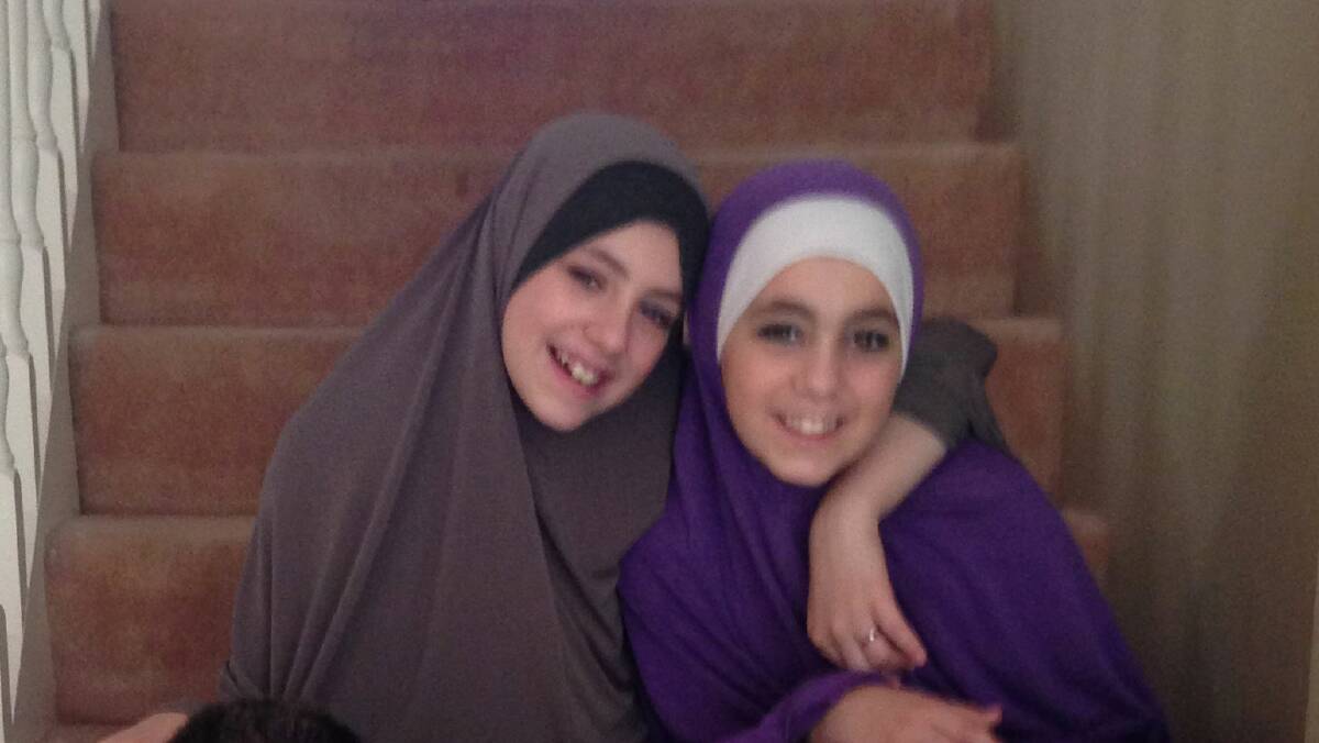 Hoda Sharrouf (right) has begged to be allowed back into Australia. She is pictured with sister Zaynab before leaving the country.
