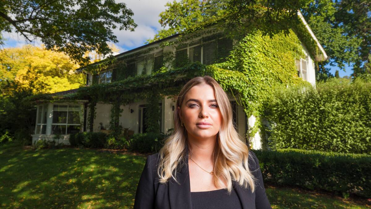 Licensed agent Sophie Luton outside an ivy-draped property at 55 Mugga Way Red Hill. Picture: Sitthixay Ditthavong