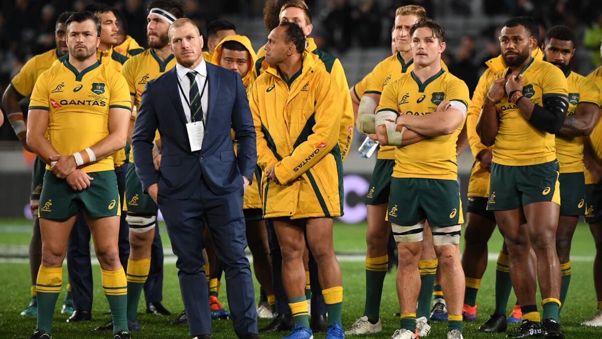 Wallabies players look on following the Bledisloe Cup match between the New Zealand All Blacks and the Australian Wallabies at Eden Park. Picture: AAP
