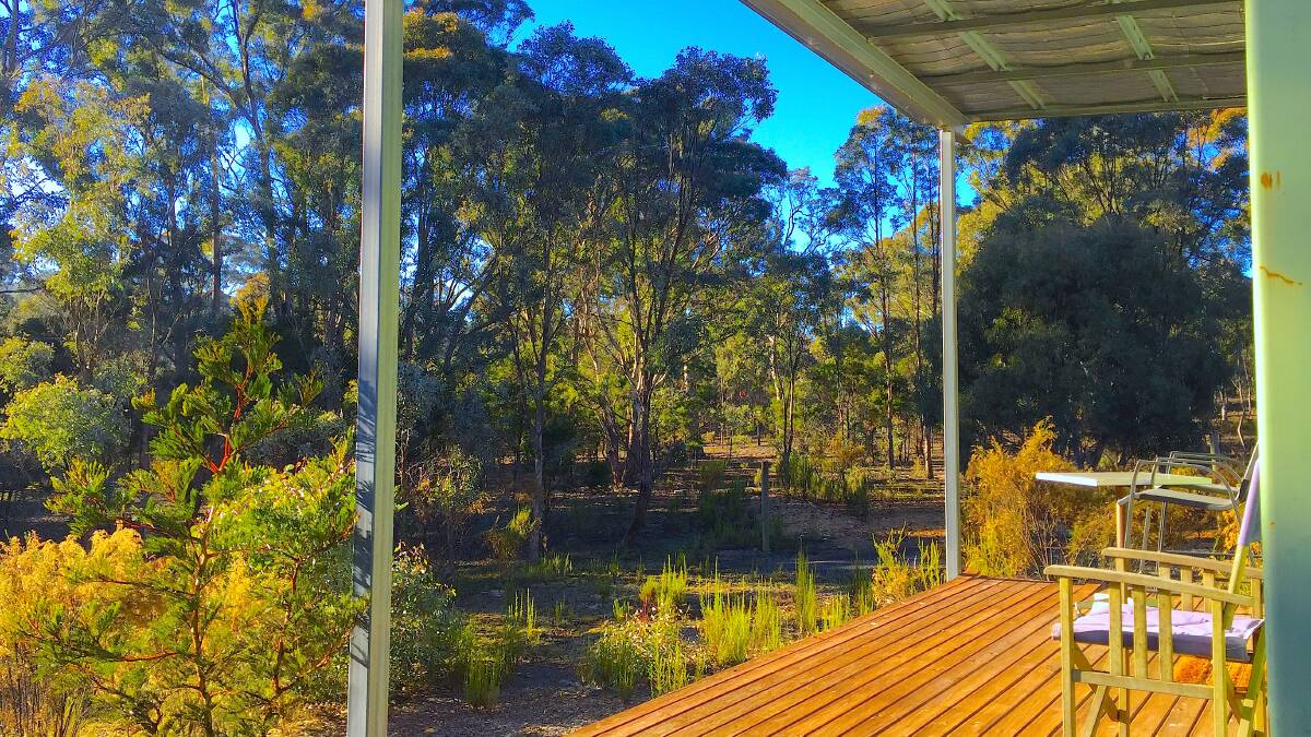 The sun-drenched deck of 'Bernstein', one of two up-cycled shipping pods converted into luxury accommodation at Greysen Estate Artists' Retreat near Collector. Picture: Supplied