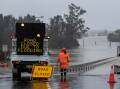 A flooded road in Windsor, New South Wales. Picture: Getty Images